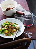 Indian lamb curry with potatoes and peas on a bed of rice