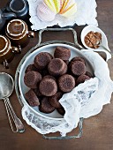 Lots of chocolate muffins on a serving plate (view from above)