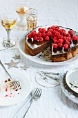 Chocolate and hazelnut cake with espresso ganache and fresh raspberries, sliced