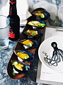 Mussels with a saffron vinaigrette and a long wooden dish