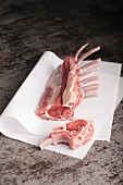 Rack of lamb on baking parchment