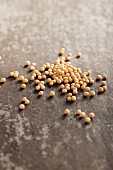 Mustard seeds on a grey surface