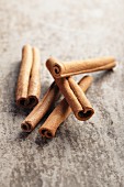 Cinnamon sticks on a grey surface