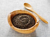 Chia seeds in a natural wood bowl