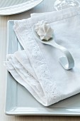 Linen napkin with hand-sewn, appliqué lace trim