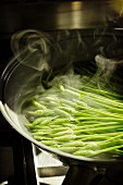 Wild asparagus being boiled in water