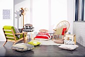 Various fashionable scatter cushions, chairs and coat stand