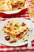 Lasagna with porcini mushrooms and tomatoes