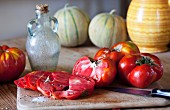 Oxheart tomatoes, one partly sliced