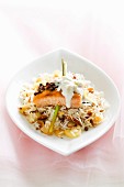 Salmon fillet with cream sauce on spiced rice