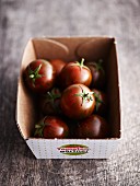 Mini tomatoes in a cardboard box