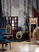 Delicate upholstered furniture, mirrors and frames - antiques from various periods in storeroom