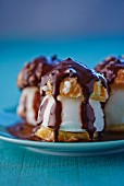 Choux pastries filled with lemon ice cream and topped with chocolate glaze