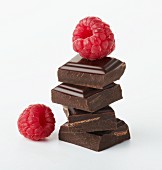 Squares of chocolate with two raspberries