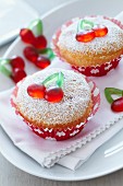 Cupcakes decorated with cherry jelly sweets