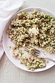 Barley risotto with pesto, butter and hazelnuts