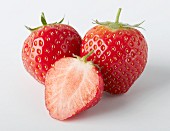 Two whole and one half strawberry