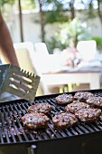 Meat patties on a barbecue