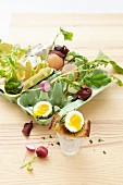 Boiled eggs with cress, radishes and béchamel sauce