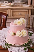 A wedding cake with white roses