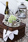 Romantic picnic with wine glasses on picnic basket