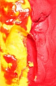 Mixed red and yellow ice cream (close-up)