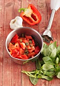 Ingredients for gazpacho: red pepper, capers, garlic, basil