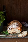 Sun dried tomato and basil bread with a buttered slice
