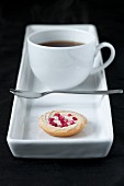 Cup of coffee with small shortbread biscuit