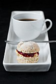 cup of coffee with small scone