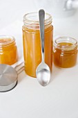 Apricot jam with ginger in jam jars
