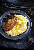 Breaded chicken leg with mashed potato