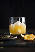 A whisky cocktail with orange