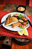 Breaded schnitzel with vegetable accompaniments