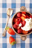 Strawberries and raspberries with whipped cream