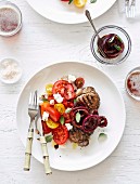 Sirloin steaks with tomato, ricotta and quick onion pickle