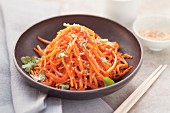 Fried grated carrot with sesame seeds and coriander (Asia)