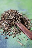 Japanese green tea on a wooden spoon