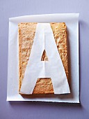 A cake with a template of the letter A