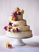 Four-tier wedding cake with rose decoration