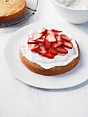 Victoria Sponge cake with cream and strawberries