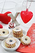 Jam-filled ring biscuits, Xmas, a fabric heart, a glass heart and Father Christmas