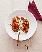Crostini with tomatoes and anchovy fillets