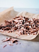 Chocolate shavings on grease-proof paper
