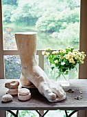 Decor on side table in screened in porch of country house