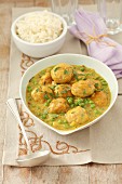 Turkey meatballs with peas in curry sauce