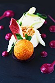 Breaded balls of goat's cheese, with radicchio