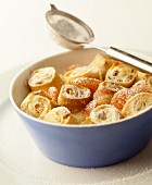 Rolled strips of pancake with quark filling, baked in the oven