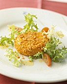 Breaded, baked Camembert with frisée lettuce