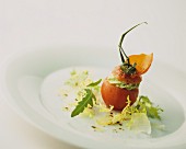 A tomato with a creamy herb filling